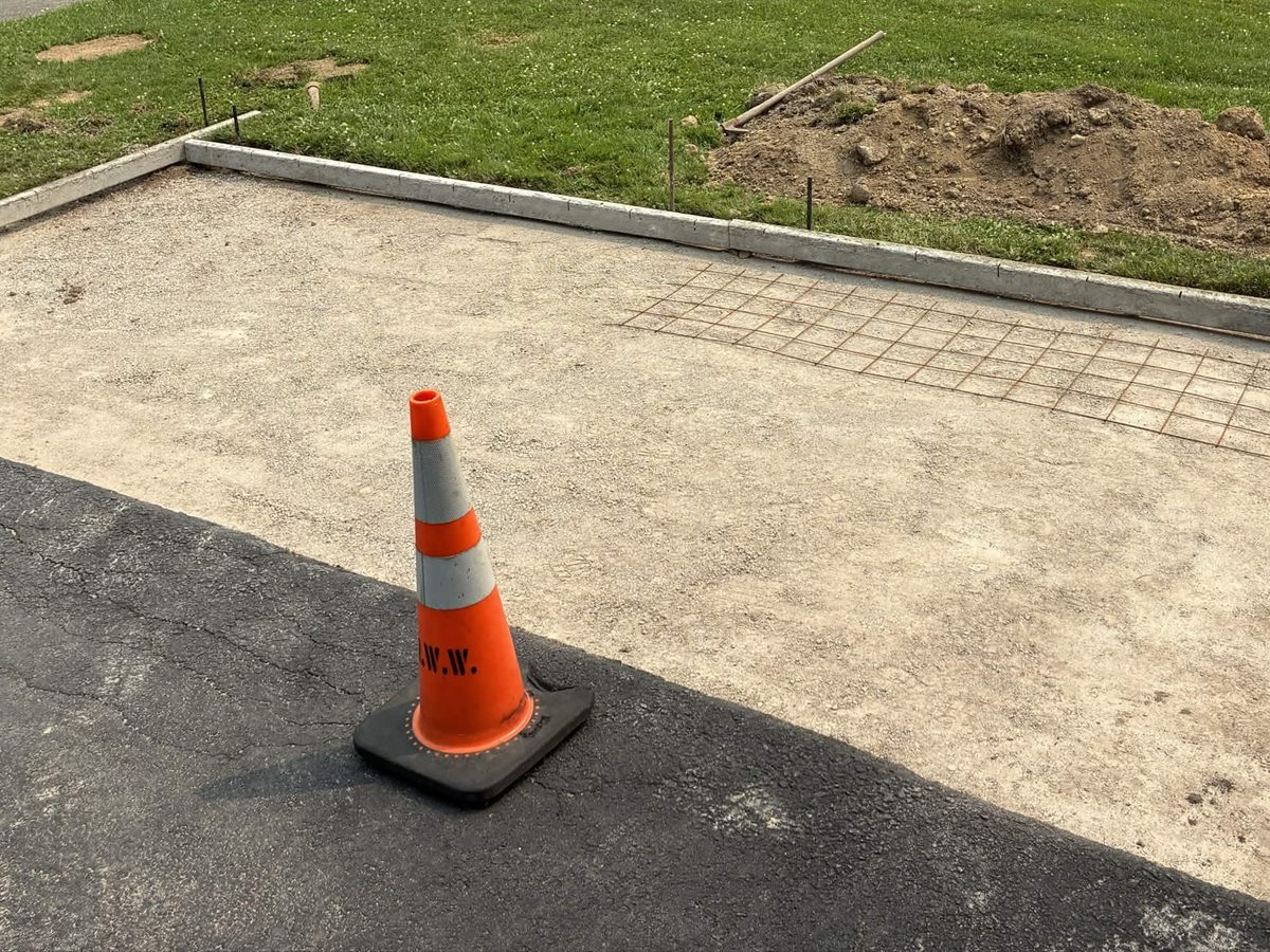 Prepared base, forms, and reinforcement for a small concrete pad